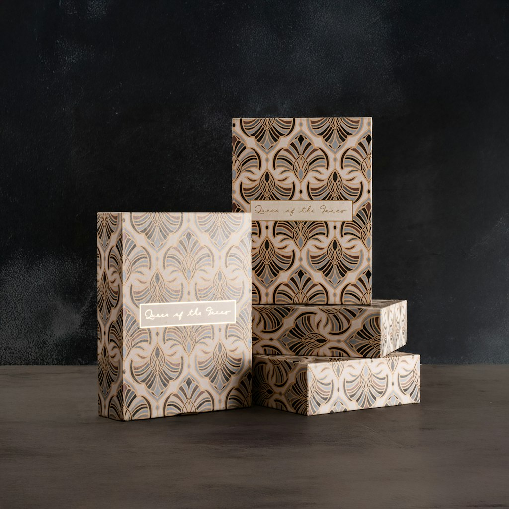 Art Dec boxes with intricate patterns on a dark background