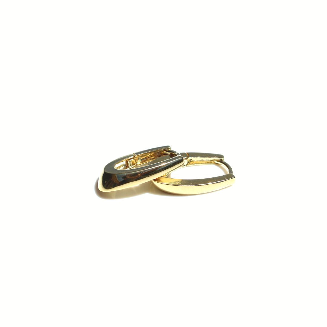 Pair of polished gold Classic Oval Link Earrings showing their elongated shape and tapered edges on a white background.