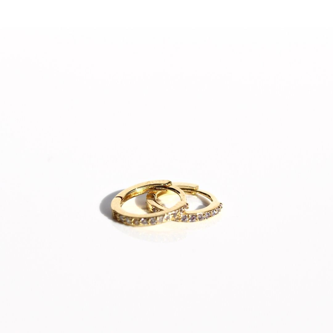 Petite Fine Sleeper earrings featuring delicate gold-plated hoops set with clear zirconias.