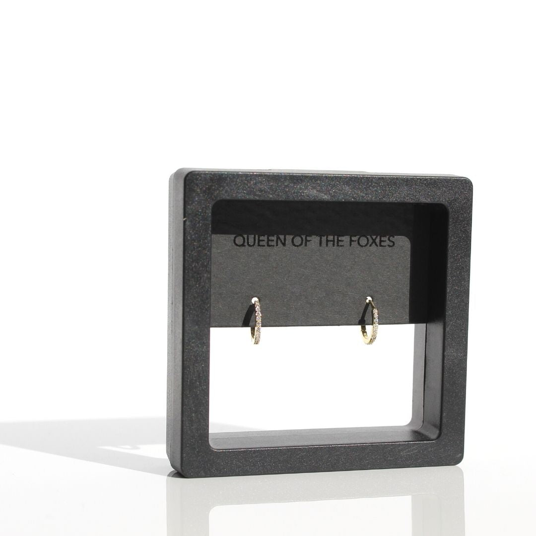 Petite Fine Sleeper earrings displayed in black Queen of the Foxes presentation packaging.