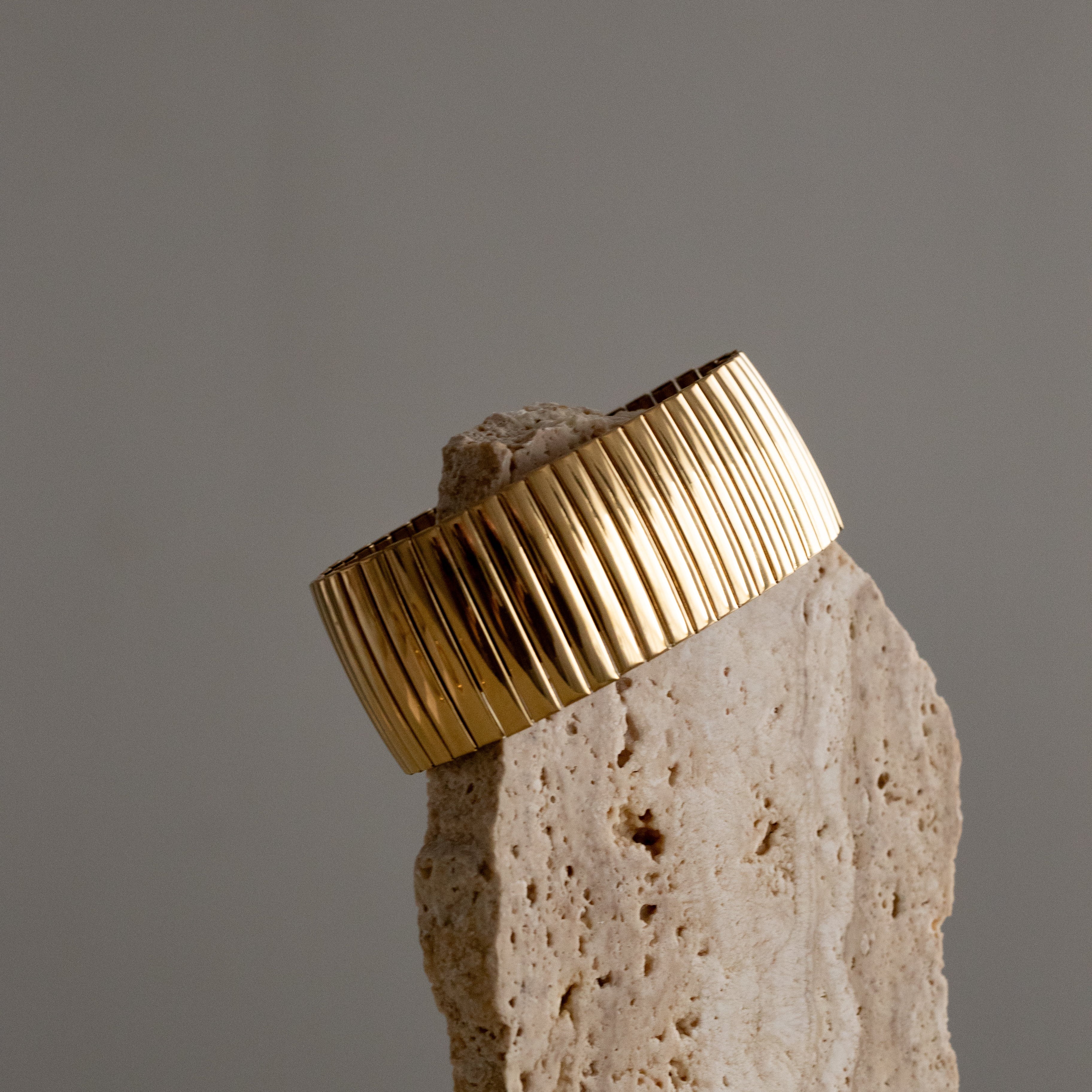 Wide, flexible gold strap bracelet 