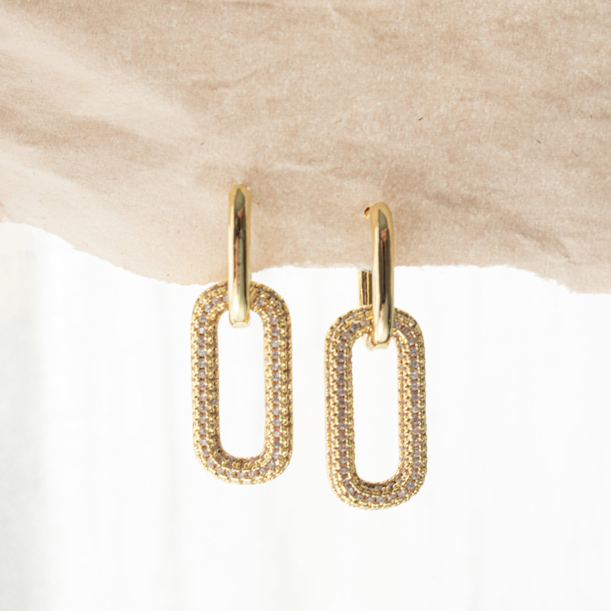 Queen of the Foxes gold-plated Madison Earrings with zirconia-set rectangular drops suspended from small hoops.