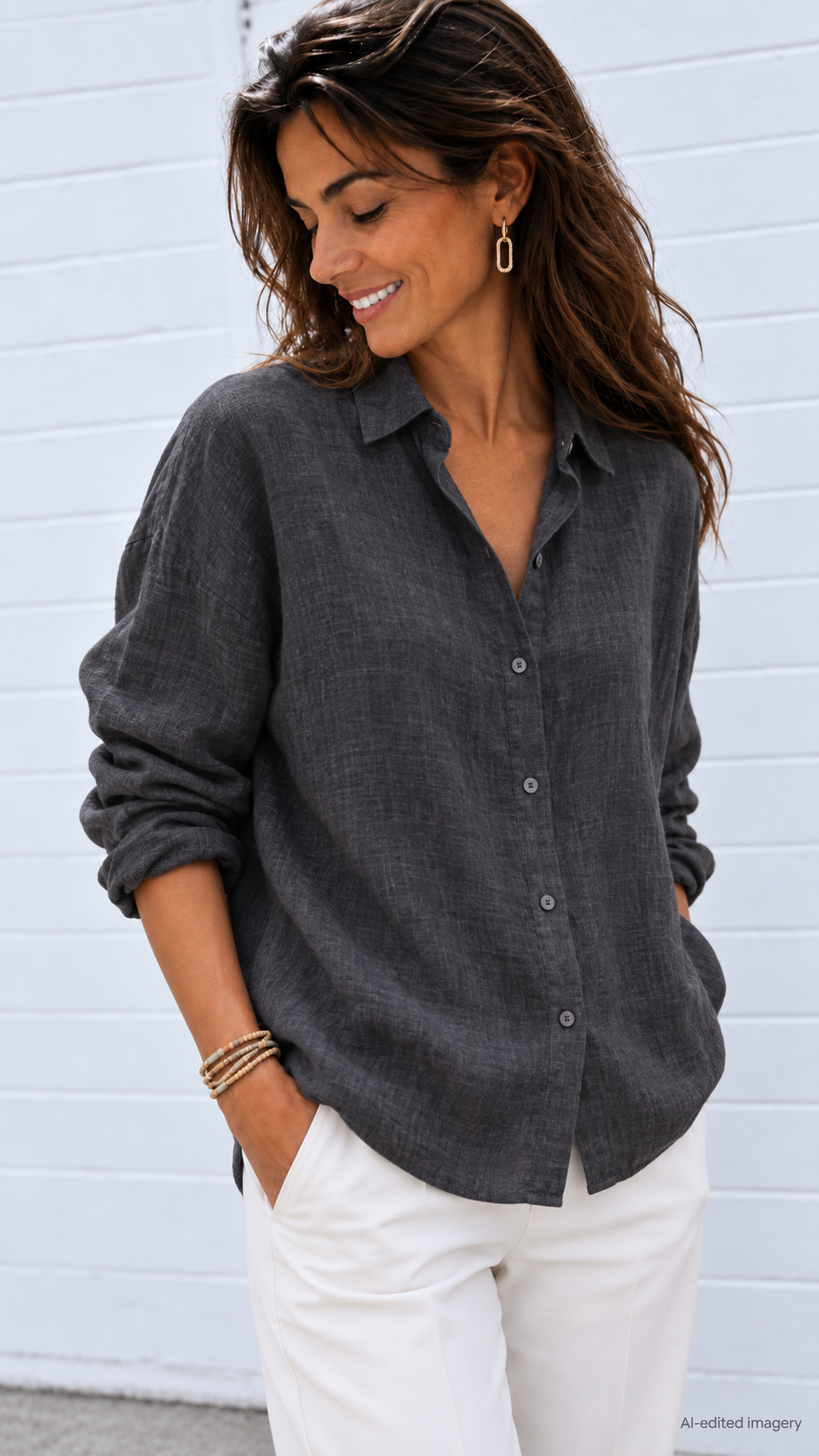 Dusky Gold Natural Wood Wrap worn loosely around a model’s wrist with a charcoal linen shirt and white trousers.